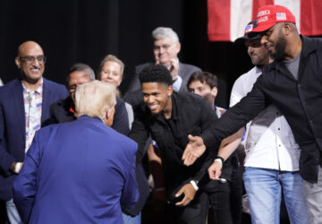 Republican presidential nominee former President Donald Trump greets supporters at a campaign event at the Cobb Energy Performing Arts Centre, Tuesday, Oct. 15, 2024, in Atlanta. (AP Photo/Alex Brandon)