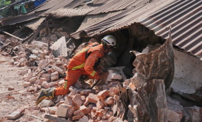 A rescuer works through rubble of a collapsed building following Friday's earthquake in Naypyitaw, Myanmar, Tuesday, April 1, 2025. (AP Photo)