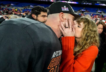 Taylor Swift kisses Kansas City Chiefs tight end Travis Kelce after an AFC Championship NFL football game against the Baltimore Ravens, Jan. 28, 2024, in Baltimore. The Kansas City Chiefs won 17-10. (AP Photo/Julio Cortez)