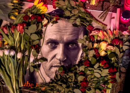 Flowers and a photo of Russian opposition leader Alexei Navalny are placed near the Russian consulate in Frankfurt, Germany, Feb. 17, 2024. Navalny, who crusaded against official corruption and staged massive anti-Kremlin protests as President Vladimir Putin's fiercest foe, died in the Arctic penal colony where he was serving a 19-year sentence, Russia's prison agency said. He was 47. (AP Photo/Michael Probst)