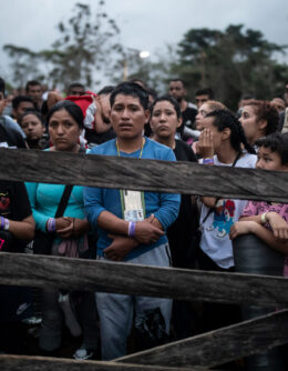 Migrants planning to start walking across the Darien Gap from Colombia to Panama in hopes of reaching the U.S. gather at the trailhead camp in Acandi, Colombia, May 9, 2023. The image was part of a series by Associated Press photographers Ivan Valencia, Eduardo Verdugo, Felix Marquez, Marco Ugarte Fernando Llano, Eric Gay, Gregory Bull and Christian Chavez that won the 2024 Pulitzer Prize for feature photography. (AP Photo/Ivan Valencia)