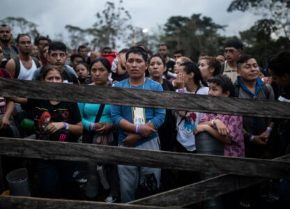 Migrants planning to start walking across the Darien Gap from Colombia to Panama in hopes of reaching the U.S. gather at the trailhead camp in Acandi, Colombia, May 9, 2023. The image was part of a series by Associated Press photographers Ivan Valencia, Eduardo Verdugo, Felix Marquez, Marco Ugarte Fernando Llano, Eric Gay, Gregory Bull and Christian Chavez that won the 2024 Pulitzer Prize for feature photography. (AP Photo/Ivan Valencia)