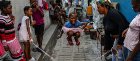 A girl plays a jump rope game at a school housing residents displaced by gang violence in Port-au-Prince, Haiti, May 15, 2024. (AP Photo/Ramon Espinosa)