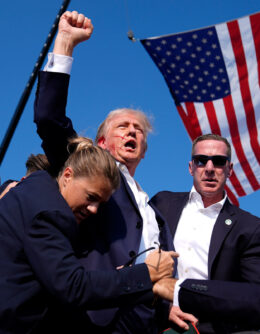 Republican presidential candidate former President Donald Trump is surrounded by U.S. Secret Service agents after an assassination attempt at a campaign rally in Butler, Pa., July 13, 2024. (AP Photo/Evan Vucci)