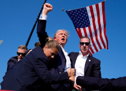 Republican presidential candidate former President Donald Trump is surrounded by U.S. Secret Service agents after an assassination attempt at a campaign rally in Butler, Pa., July 13, 2024. (AP Photo/Evan Vucci)