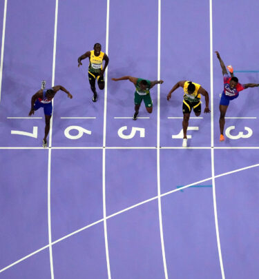 Noah Lyles, of the United States, in lane seven, wins the men’s 100-meter final at the 2024 Summer Olympics, Aug. 4, 2024, in Saint-Denis, France. (AP Photo/David J. Phillip)
