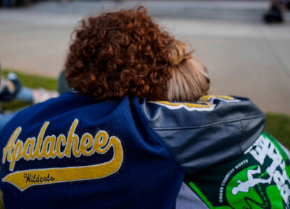 Mourners listen to a speaker during a candlelight vigil for the slain students and teachers at Apalachee High School, Sept. 4, 2024, in Winder, Ga. (AP Photo/Mike Stewart)