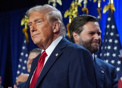 Republican presidential nominee former President Donald Trump and his running mate Sen. JD Vance, R-Ohio, stand on stage at an election night watch party at the Palm Beach Convention Center, Nov. 6, 2024, in West Palm Beach, Fla. (AP Photo/Evan Vucci)